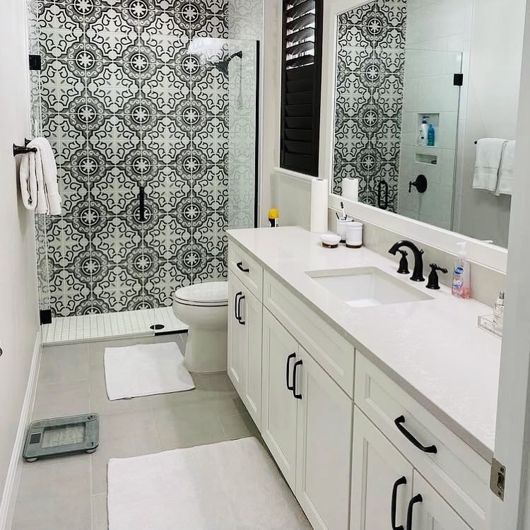 person wearing black and white nike athletic shoes