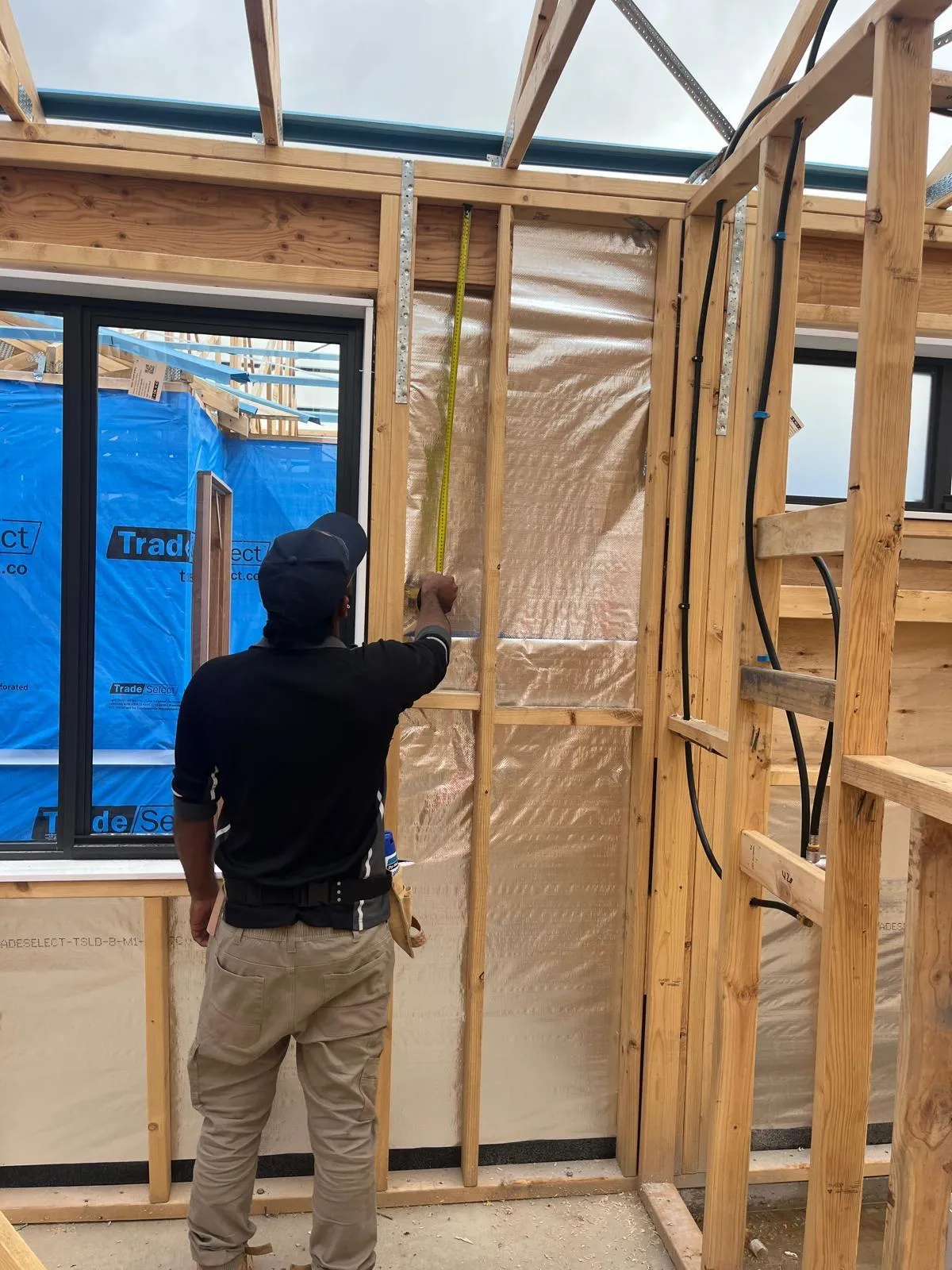 Building inspector examining roof frame