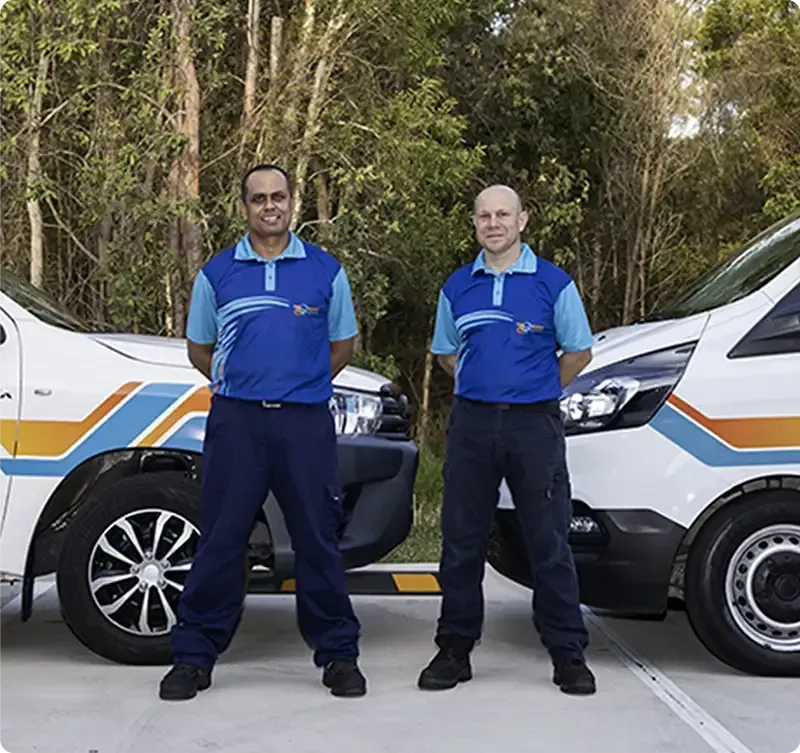Queensland roadworthy inspectors standing beside a vehicle for mobile safety certificate inspection