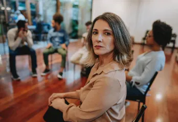 Determined advocate at a group meeting