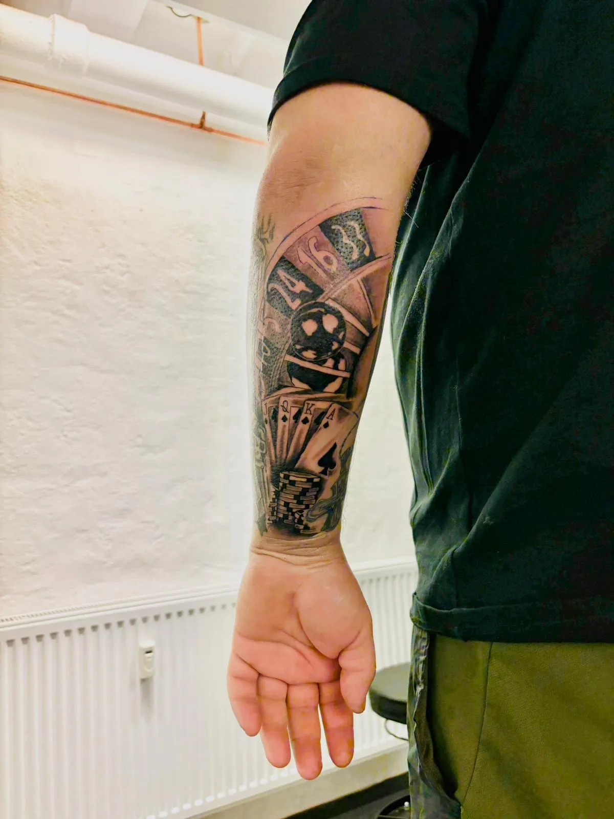 person with tattoo on right arm