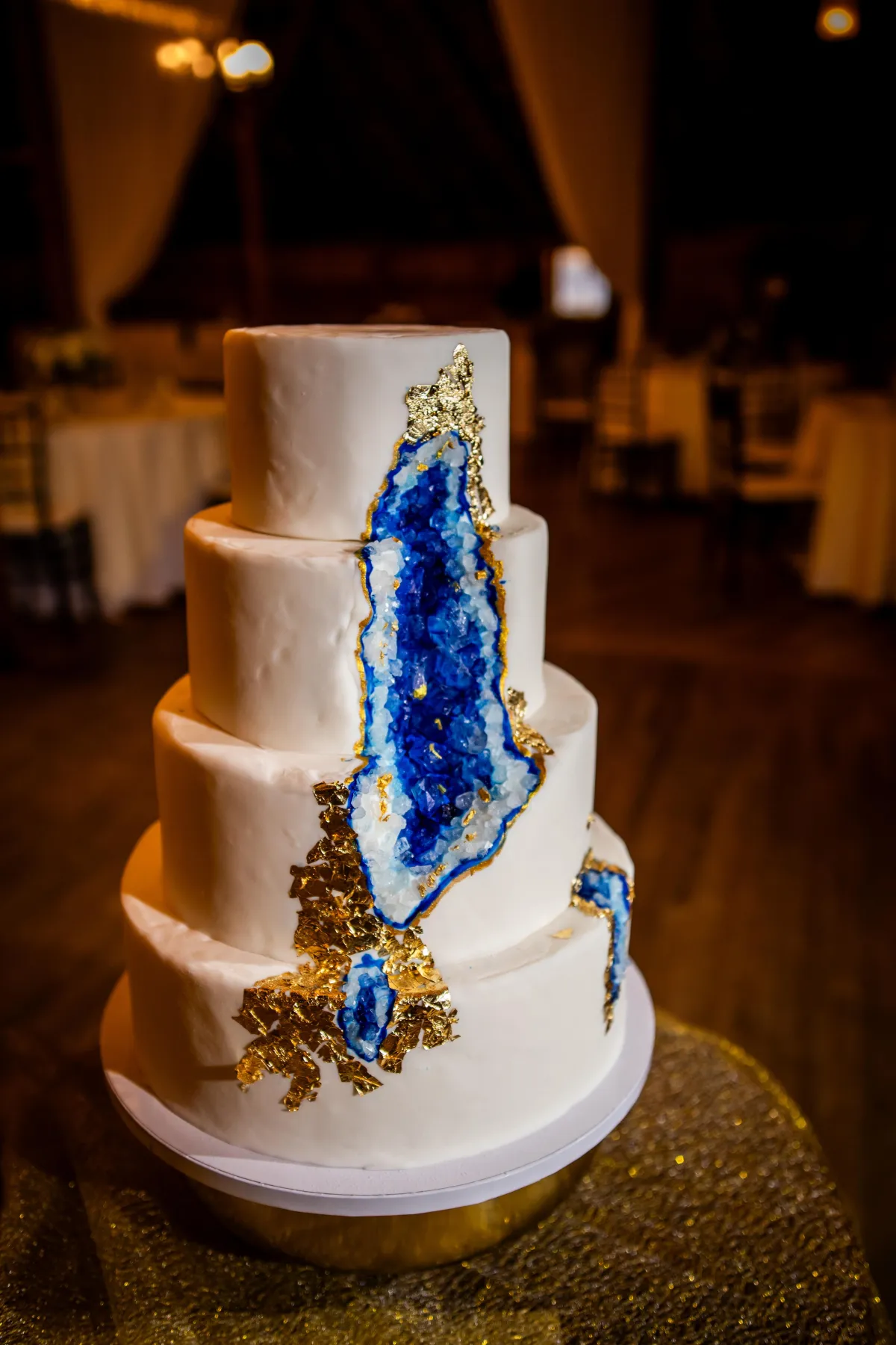 Elegant tiered artisan wedding cake in blush and ivory tones