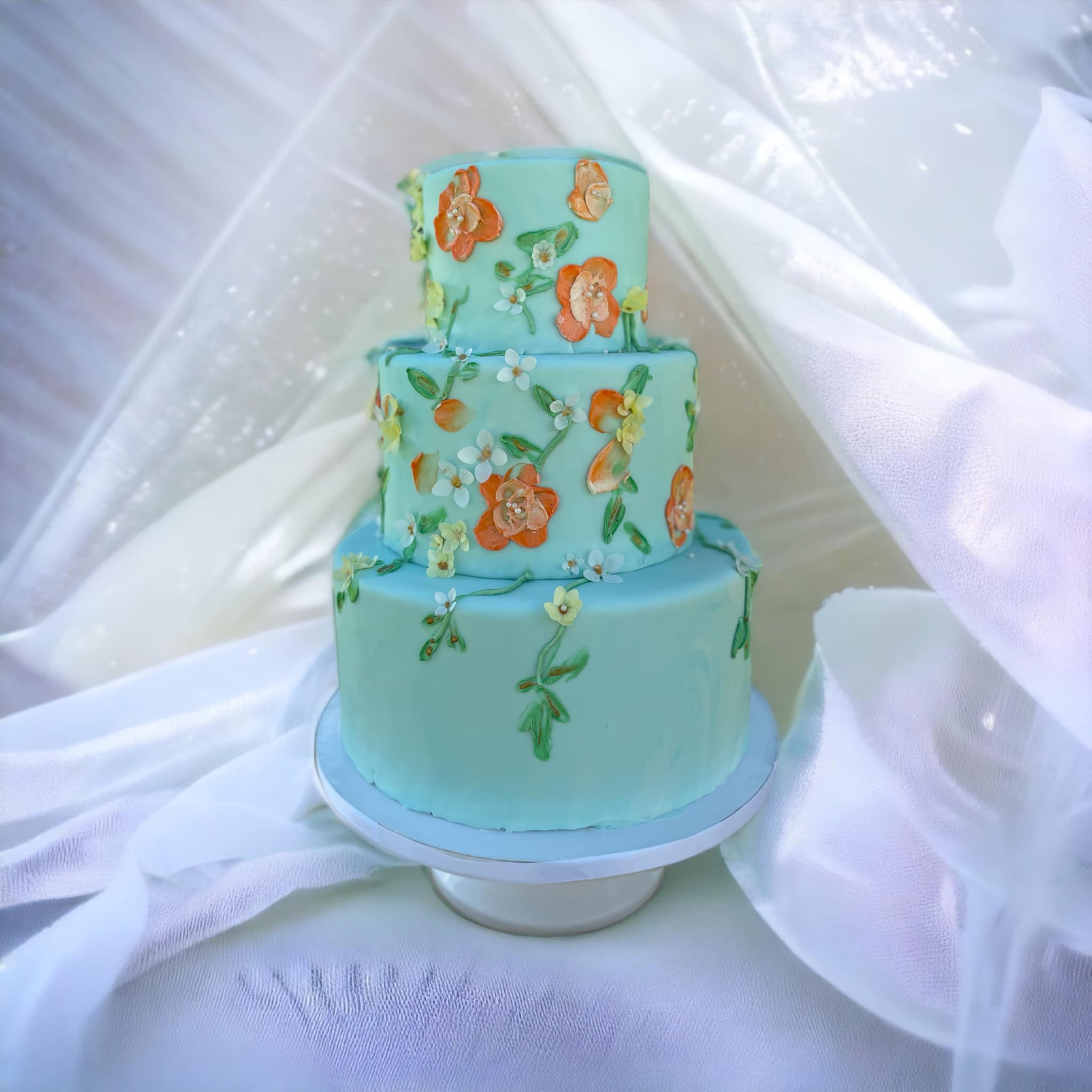 Detail of hand-painted buttercream texture on a custom wedding cake