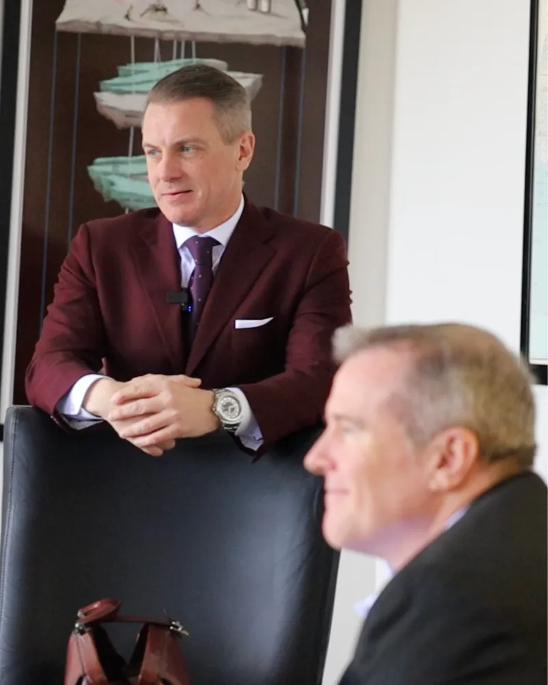 Jimmy Hays Nelson and Dr. Danny Brassell speaking with a client during a one-on-one coaching session.