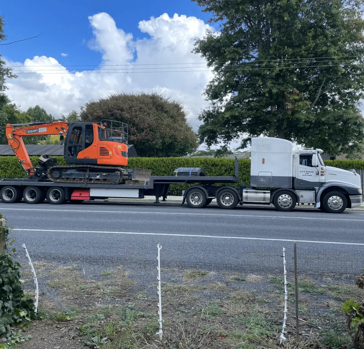 Digger and heavy machinery transport truck in Hamilton Waikato