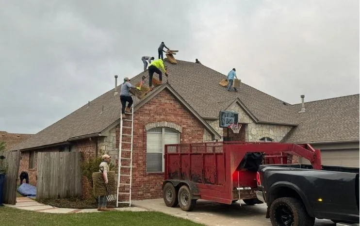 Roofing professional performing an inspection