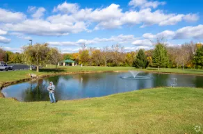Cedar deck with wide stairs in Creel Township Devils Lake