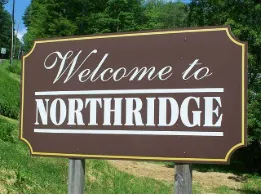 Composite deck with pergola in a North Ridge Jamestown backyard