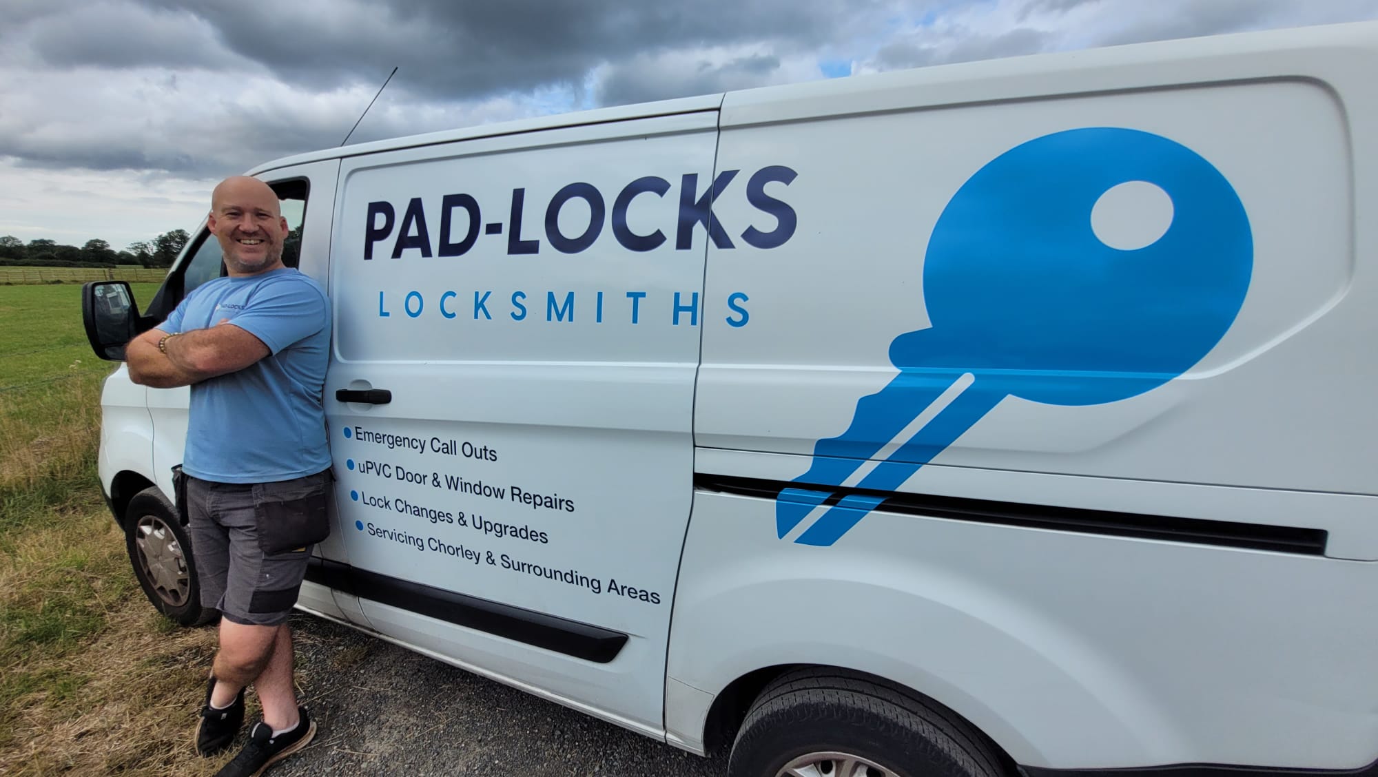 Lee Armitage standing beside the fully branded Pad-Locks Locksmiths mobile service van in Chorley and Eccleston.
