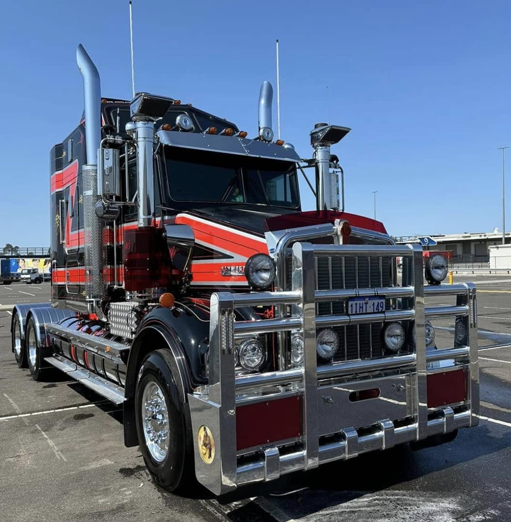 Parade float with large pink letters spelling care