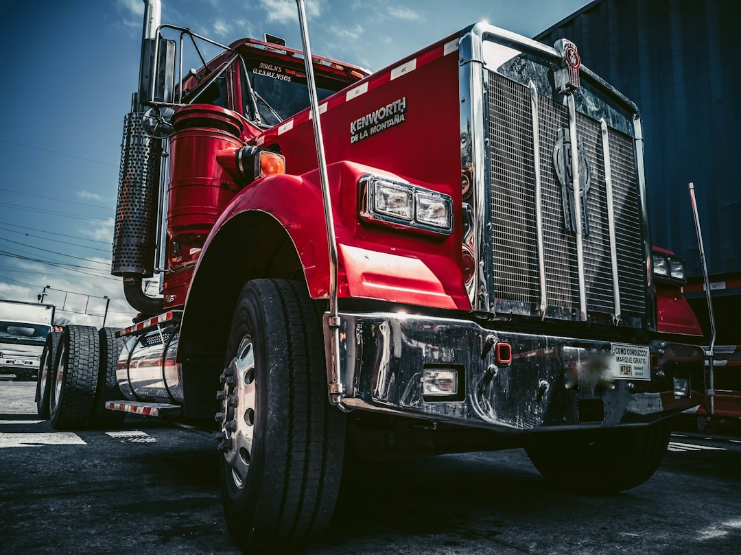 a blue truck parked in front of a building