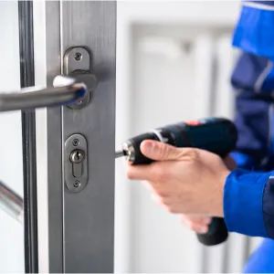 Commercial locksmith repairing door locks at a Washington DC business