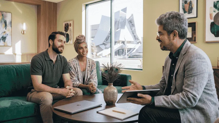 Insurance advisor meeting with clients for a coverage review