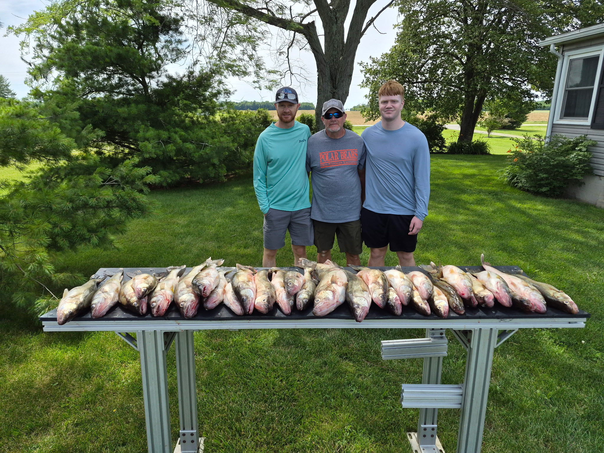 Family showing off their daily limit of walleye on a Lake Erie fishing charter boat.! Family showing off their daily limit of walleye on a Lake Erie fishing charter boat.