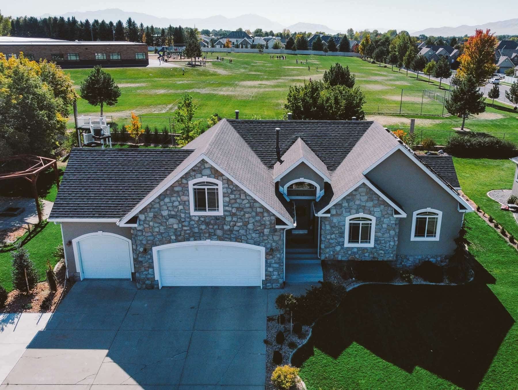 modern home with newly installed asphalt shingle roofing