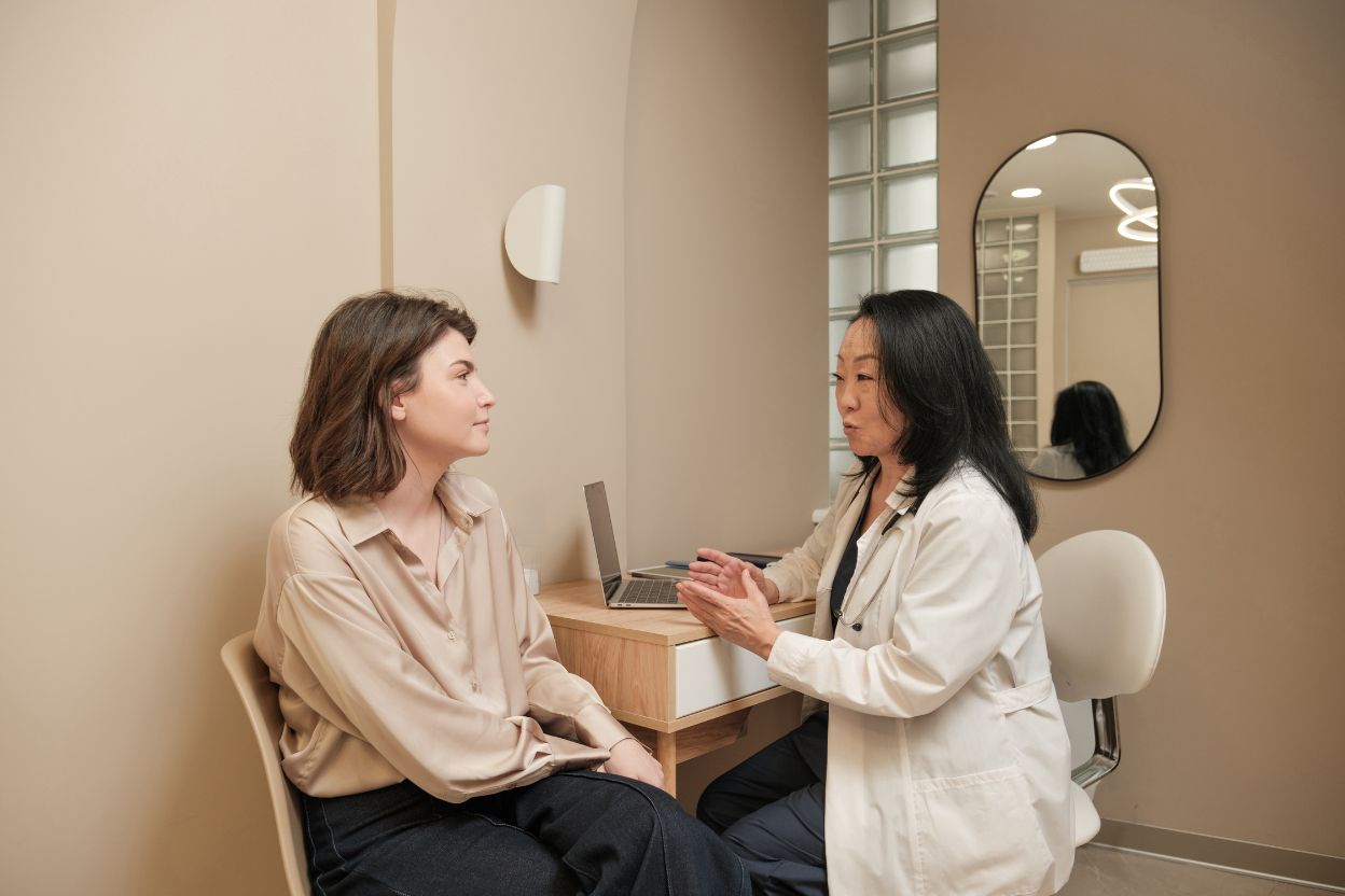 audiologist consulting with patient