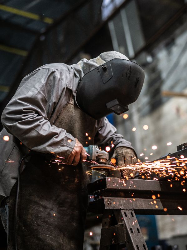 man using an industrial grinder