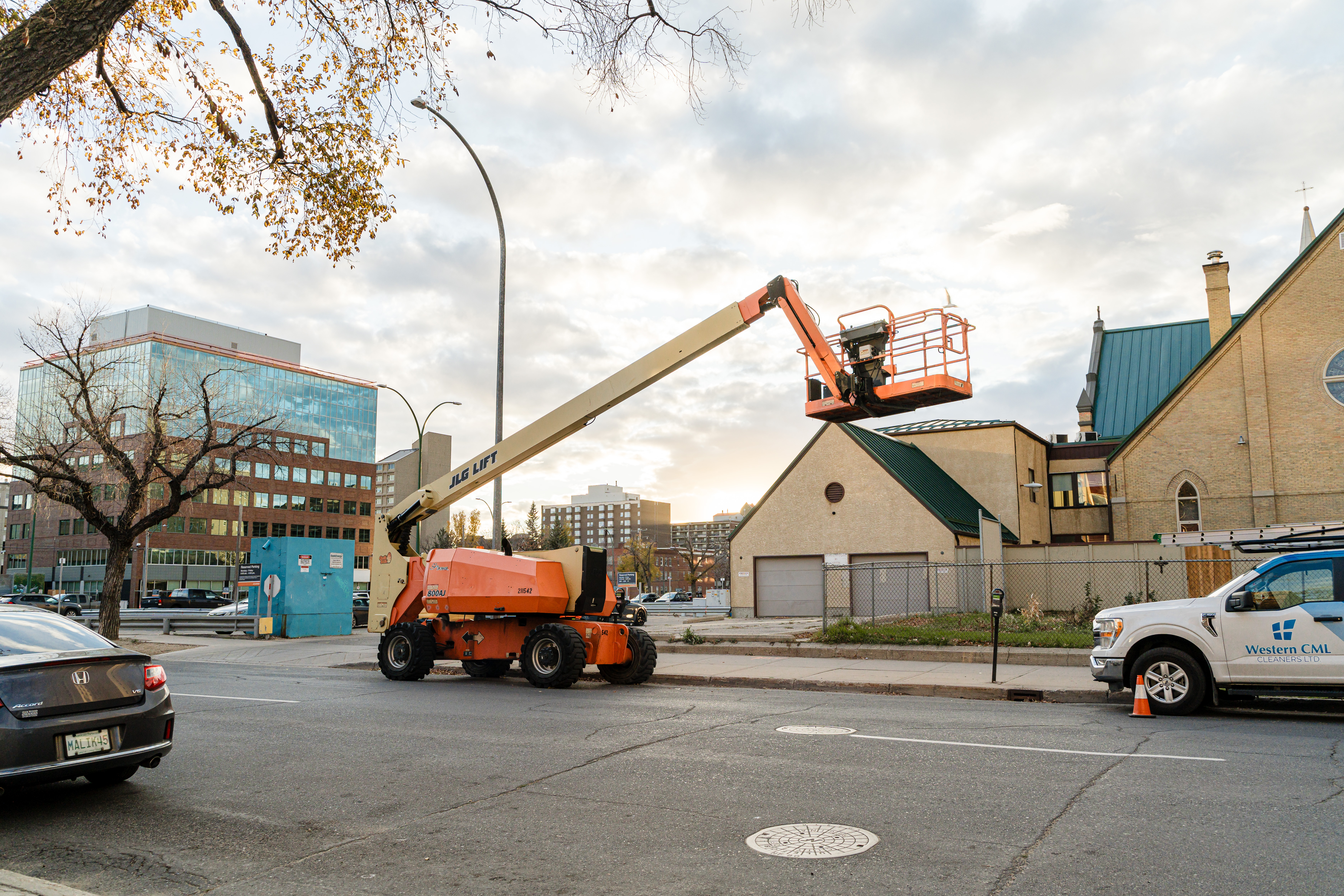 Isolated industrial forklift in studio lighting, full machine visible and centered, high-detail photographic study with neutral clipping (no background), crisp steel textures highlighting safety decals and operator compartment.