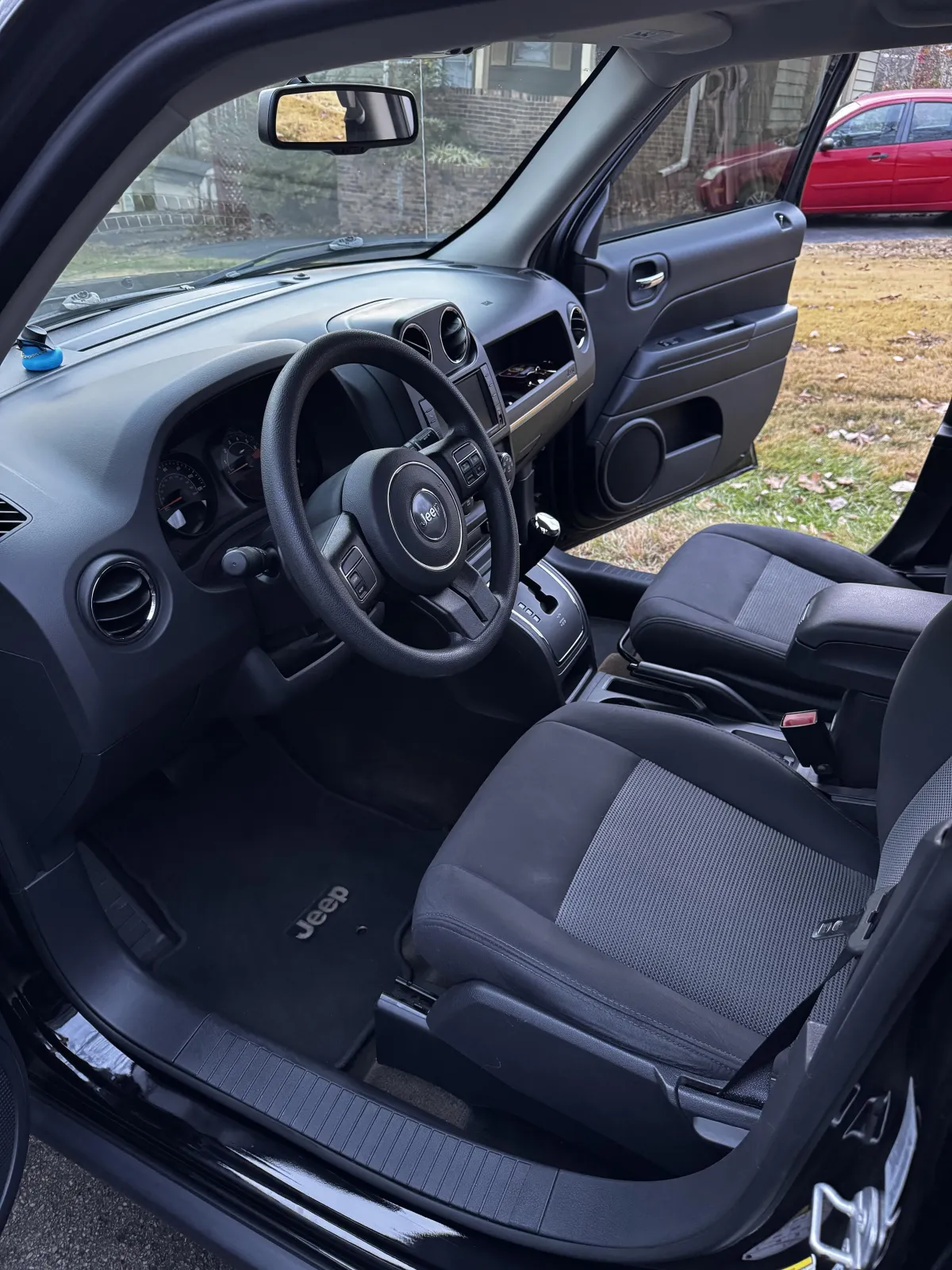 Freshly shampooed passenger seat of a professional detail | Tri-City Premier Detailing