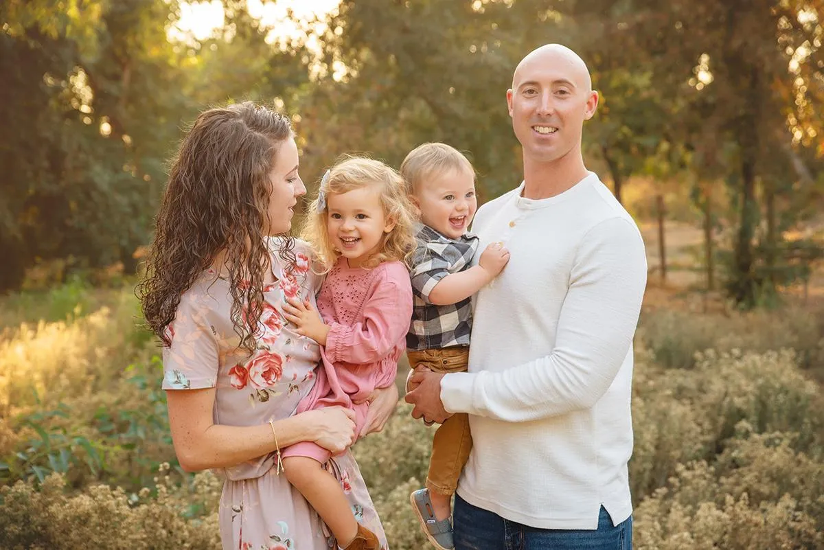 Fall Family Portrait Sessions displayed on a canvas above a couch by Fresno Photographer Christina Baltazar