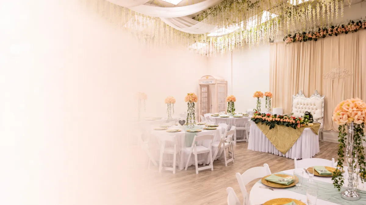 Wedding reception tables set with candles and greenery