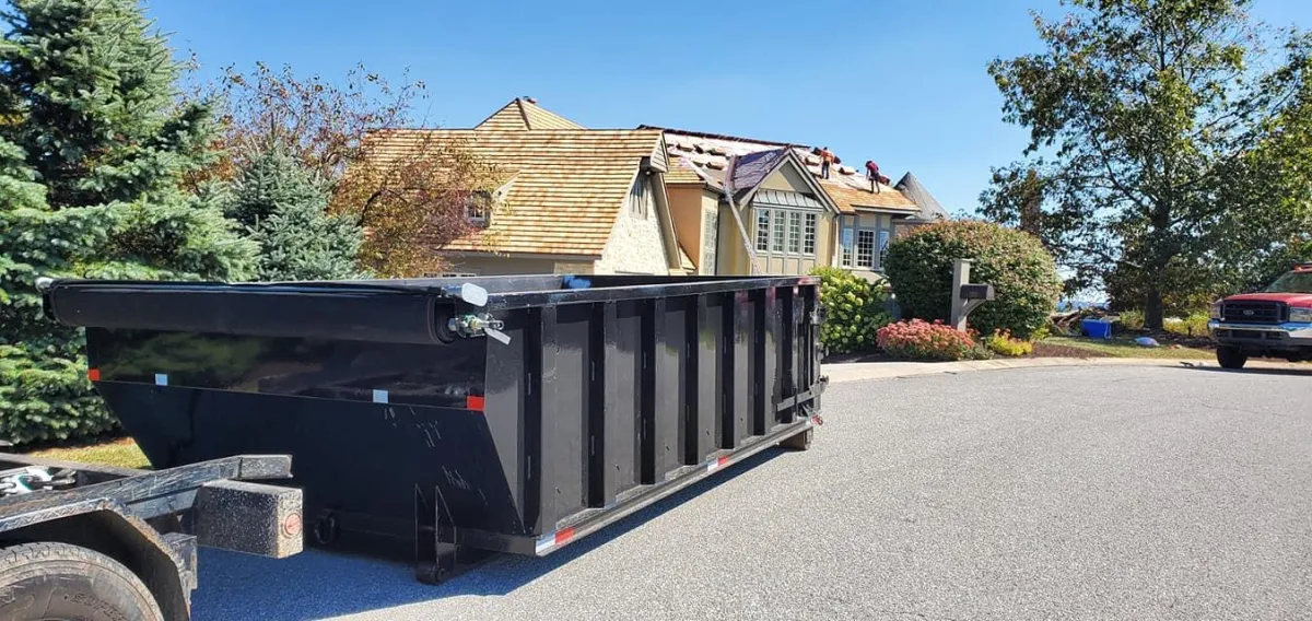 a set of shiny coated gutters of a house