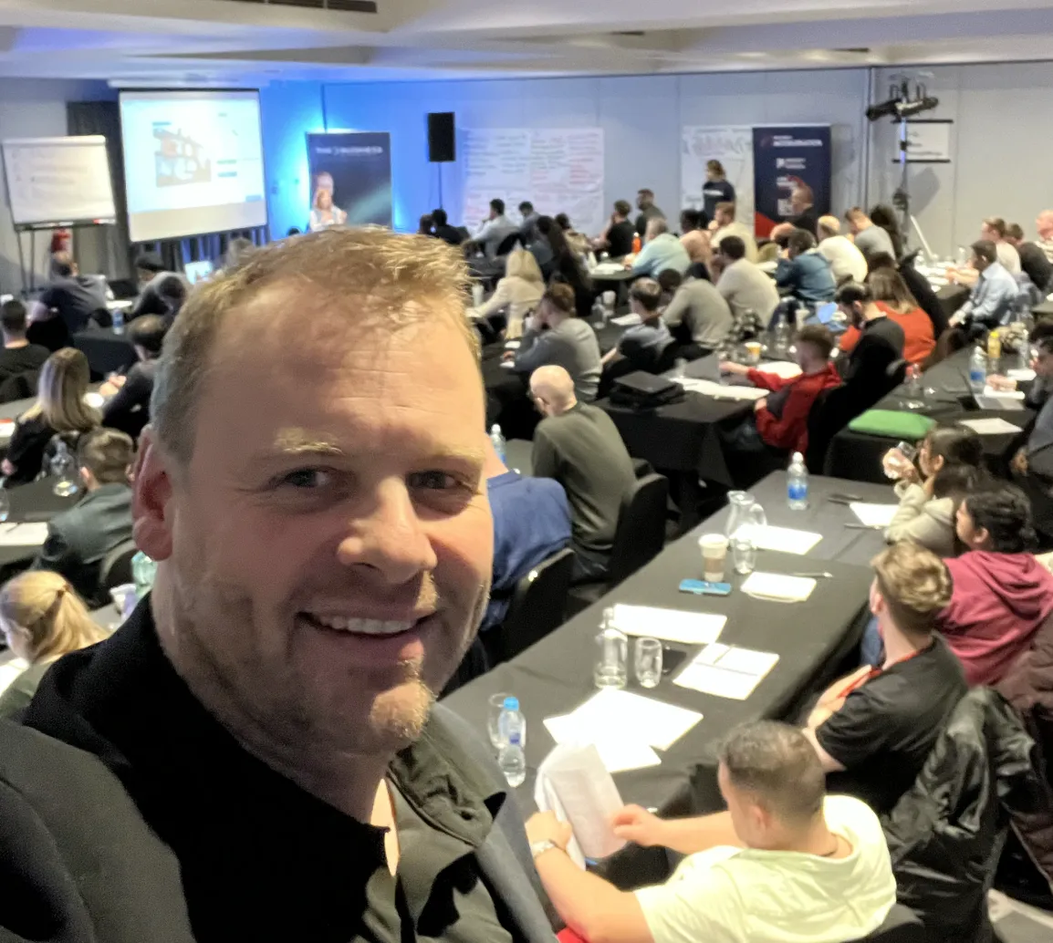 Alasdair Cunningham with a room full of delegates at a UK property training event