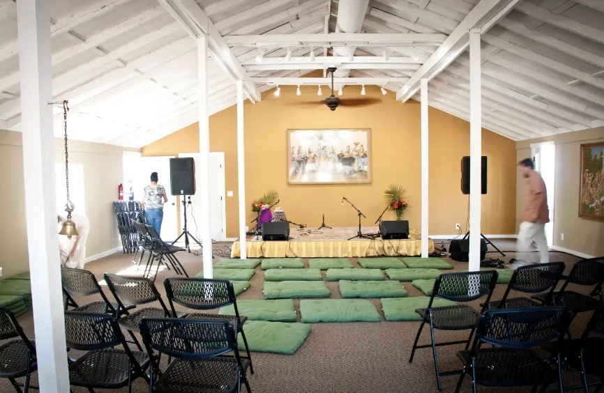 tree on body of water near mountains