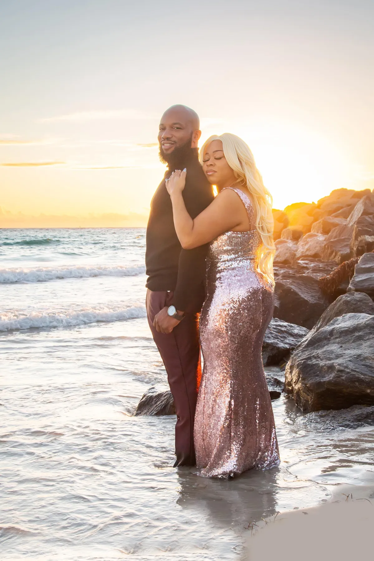 Engaged couple shares a beautiful sunrise moment at South Pointe Park