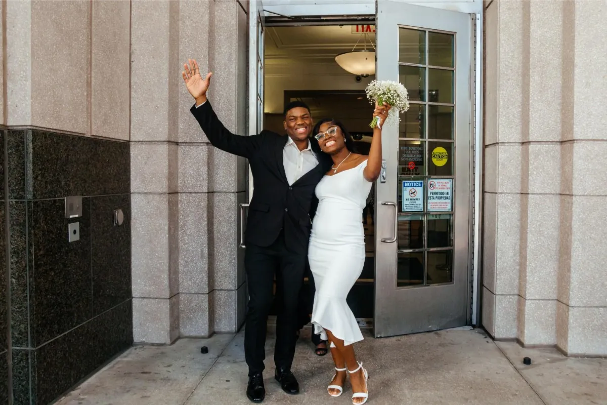  Couple shares a joyous moment leaving the Orange County Courthouse