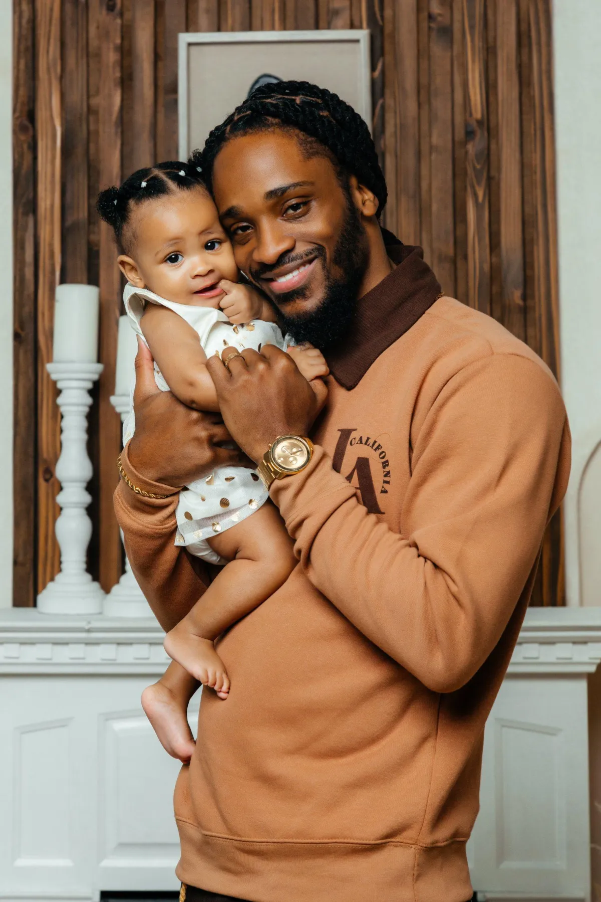 Father and daughter share a moment of laughter in the studio