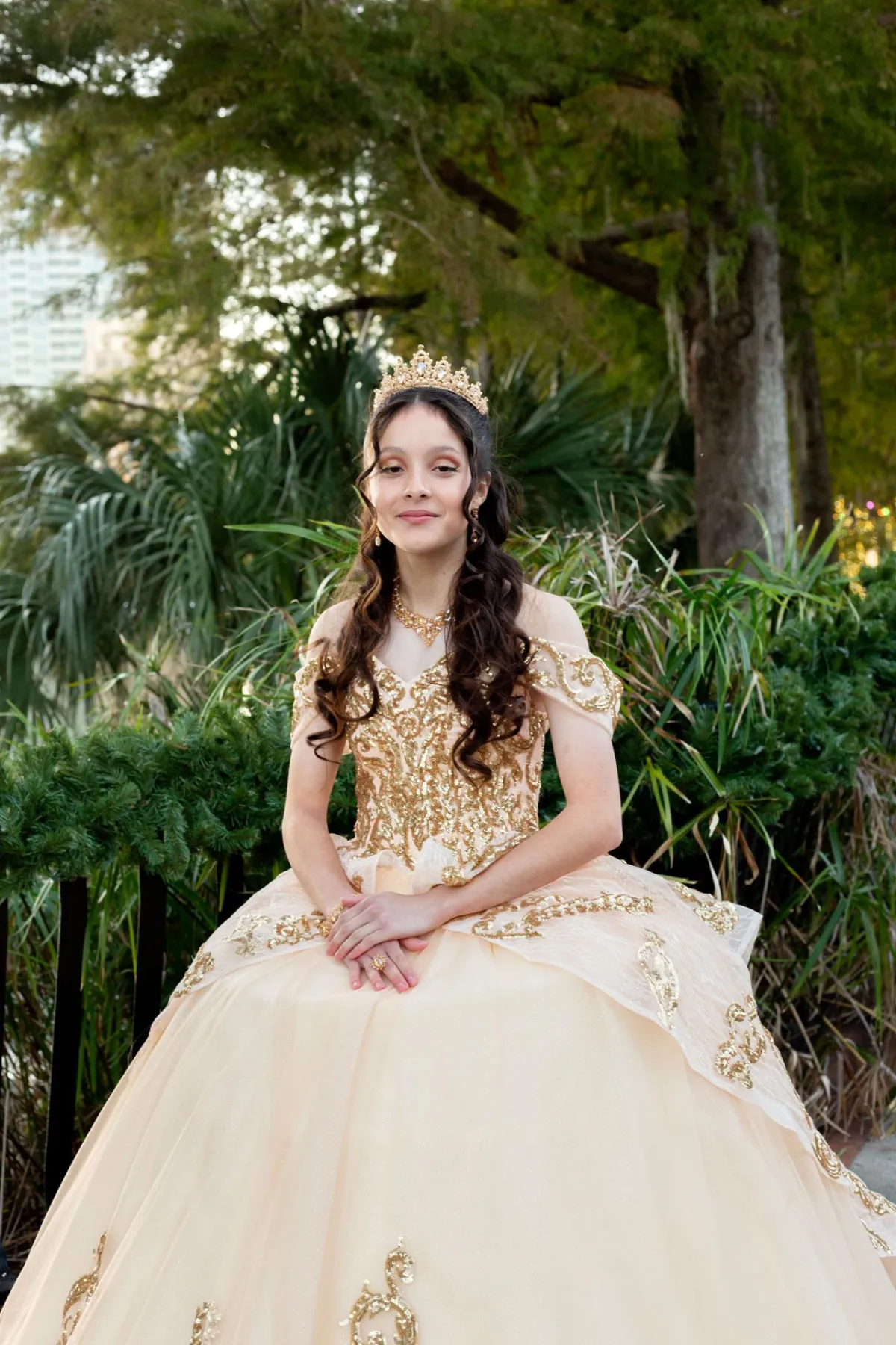 Teen taking photos at Lake Eola Park in her gown