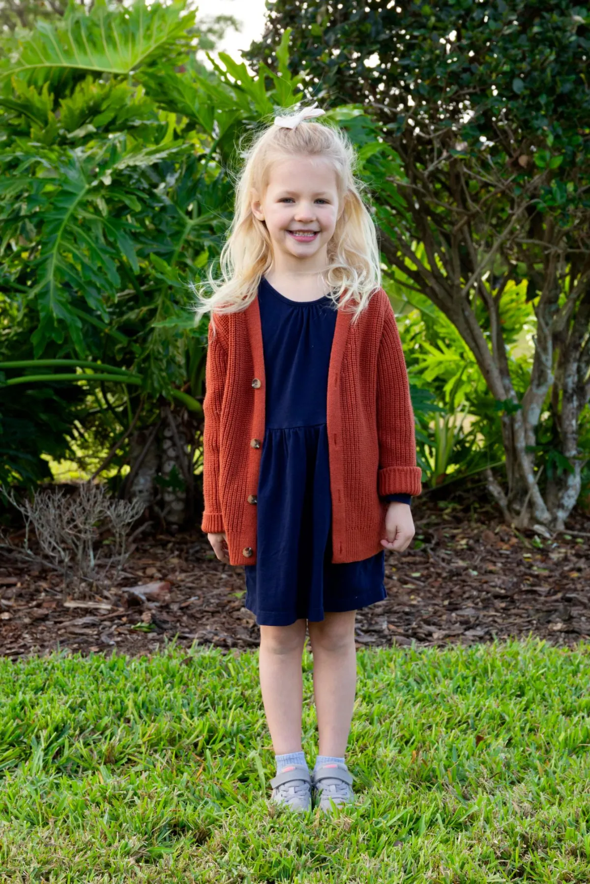Young girl smiling during family photos in Orlando f