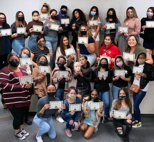 Lash Student being certified with other lash students