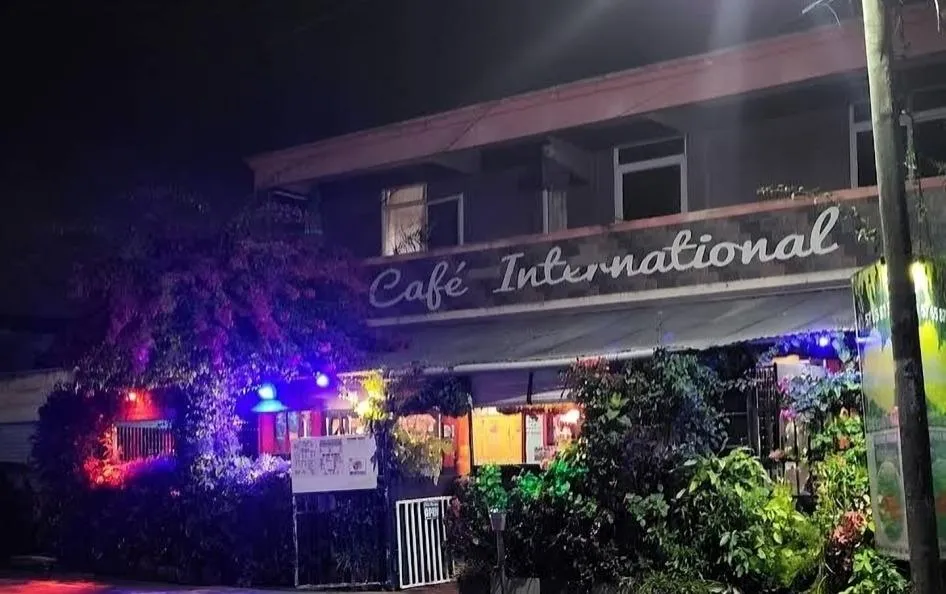 a neon sign on the side of a building