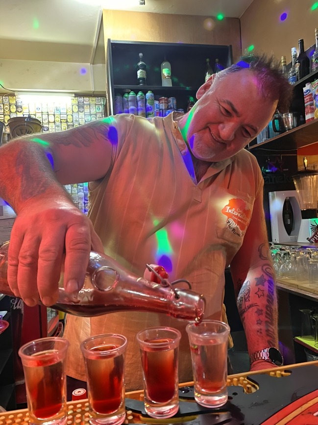 A table topped with plates of food on top of a table