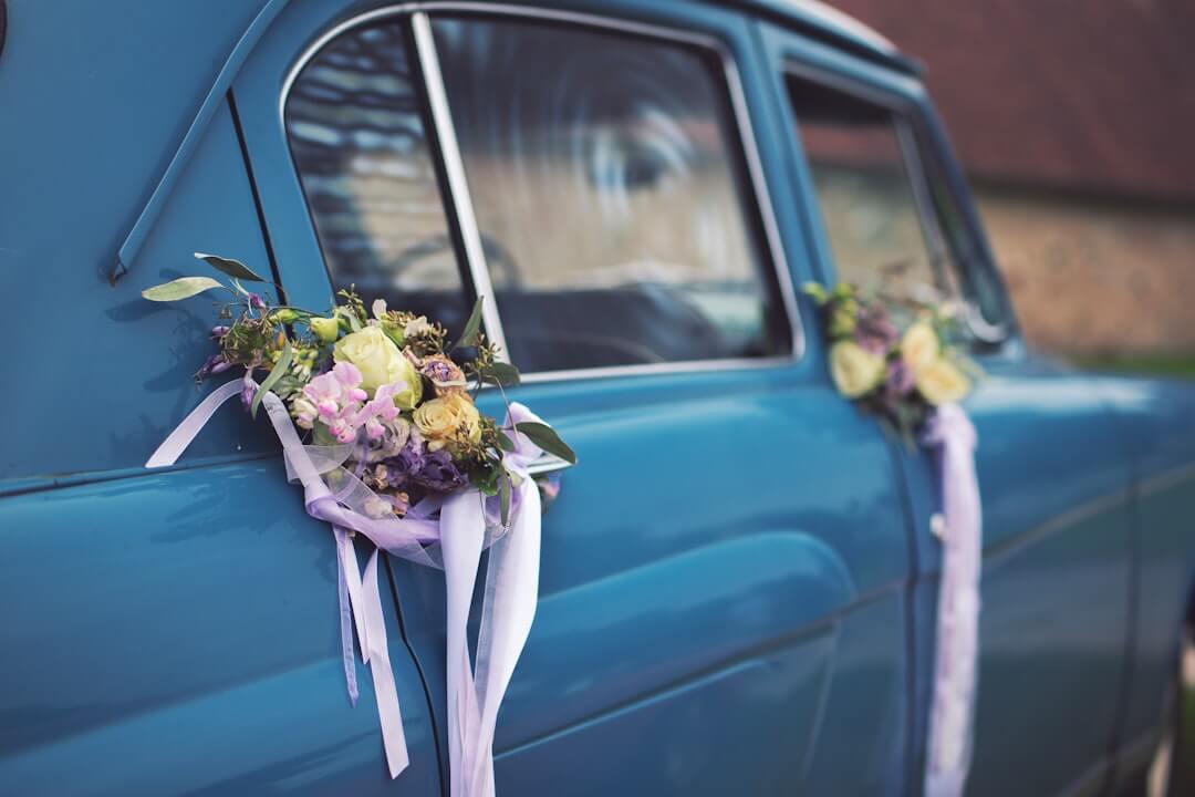 Decorated classic wedding car with floral ribbons for wedding transport in Waikato, New Zealand