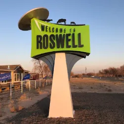 Multi-tiered deck with pergola and grill area in South Main neighborhood