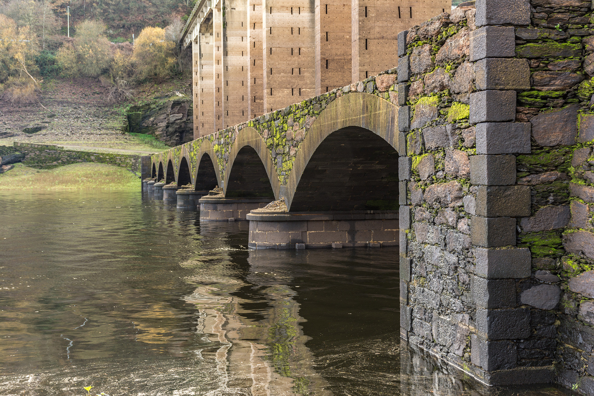 Historic stone bridge over the River Miño at Portomarín on the Camino de Santiago