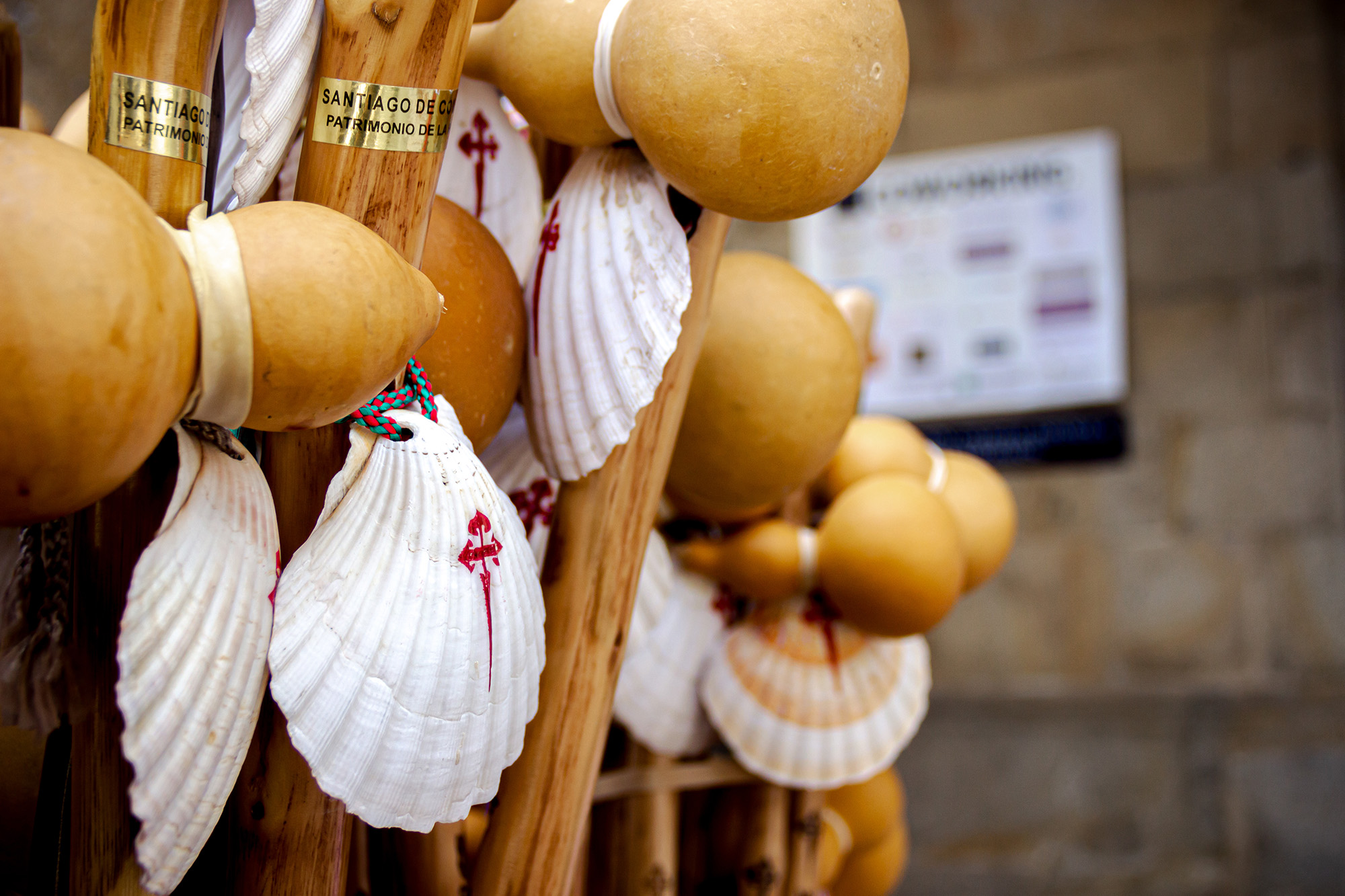 Scallop shells and wooden pilgrim gourds displayed in Santiago de Compostela