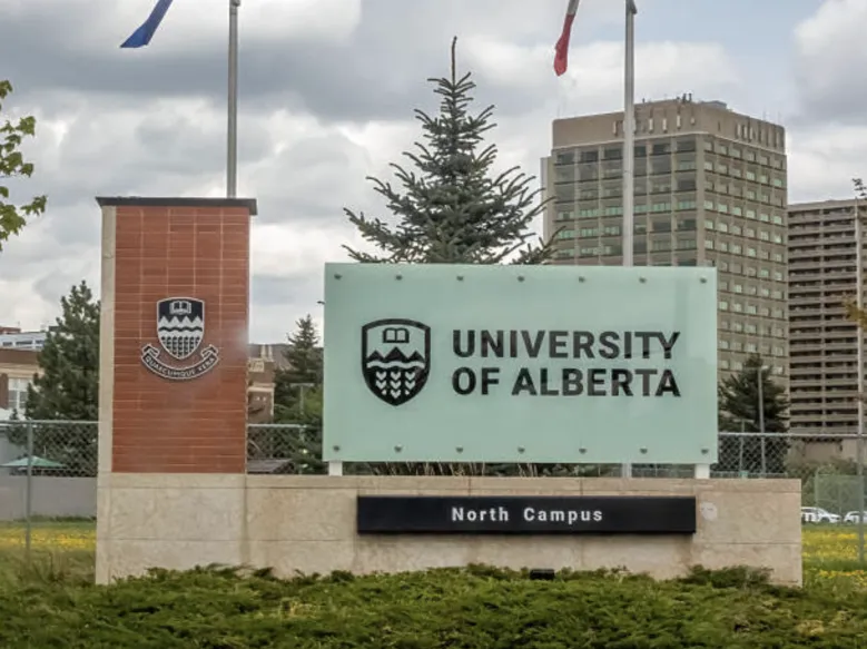 University of Alberta North Campus entrance sign with stone pillars and greenery