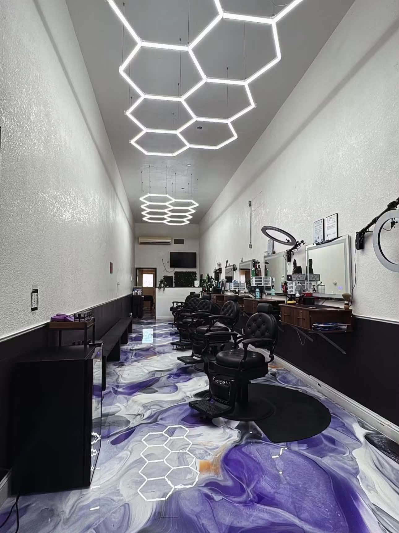 Barbershop commercial interior with decorative purple metallic epoxy floor design