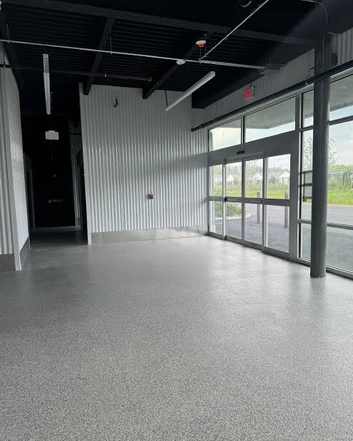 Commercial entrance interior with seamless grey epoxy concrete coating