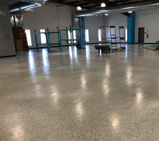 Commercial workspace interior with high-durability epoxy flake floor system