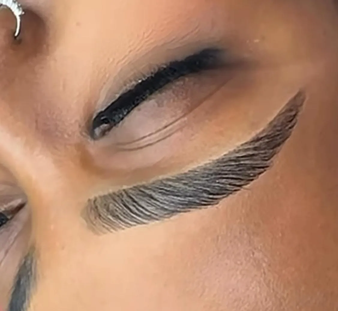 A side-by-side before-and-after of brow lamination on a young woman, with natural lighting and a neutral beige background. The transformation is clear, with fuller, more defined brows in the after image, emphasizing the service's effectiveness.