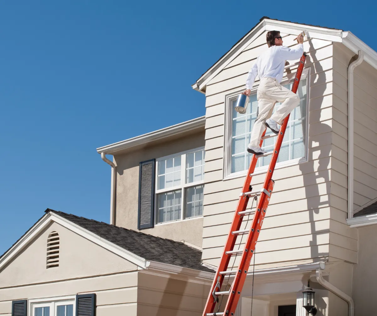 man standing infront of miter saw
