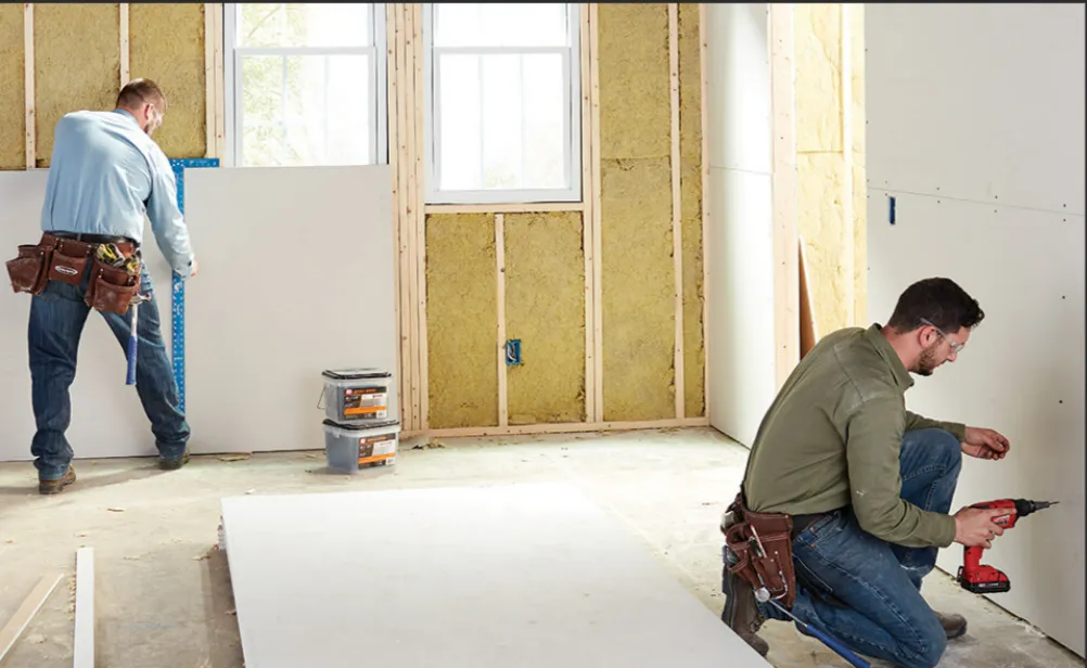 man climbing on ladder inside room