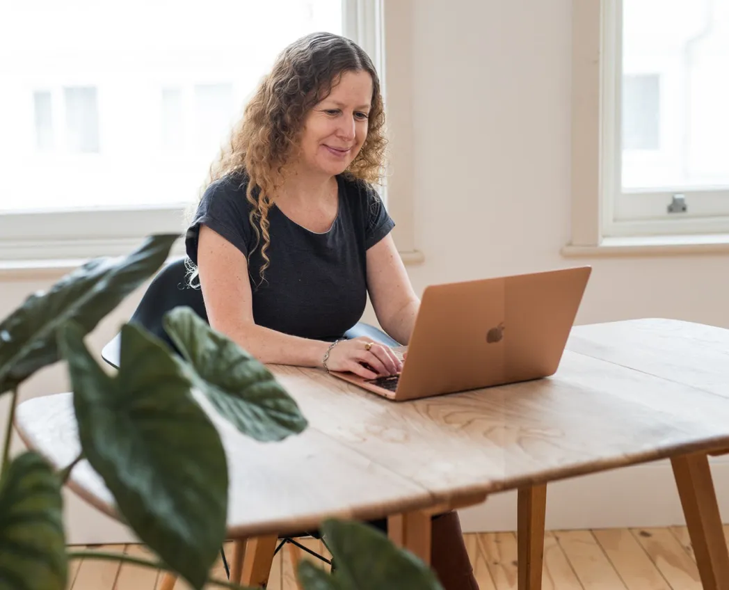 person holding orange flower petals