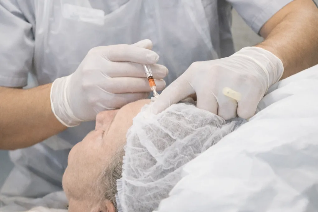 person holding black and gray car steering wheel