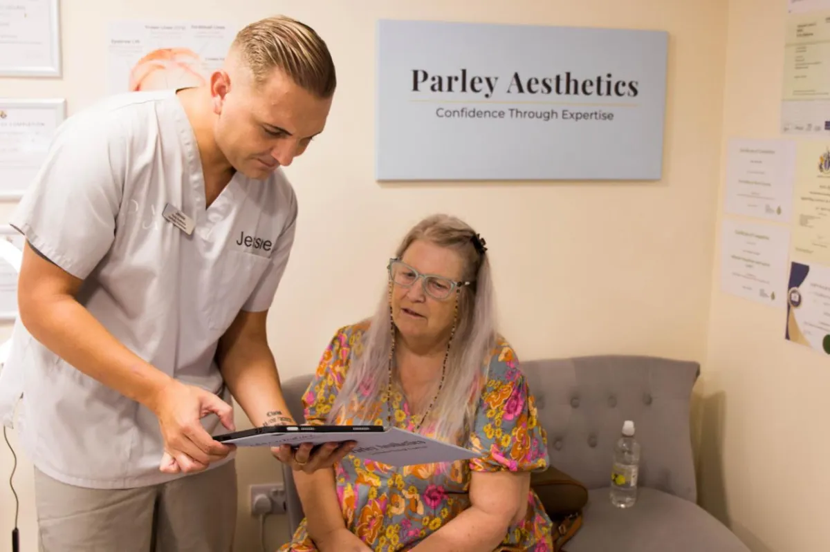 person holding black and gray car steering wheel